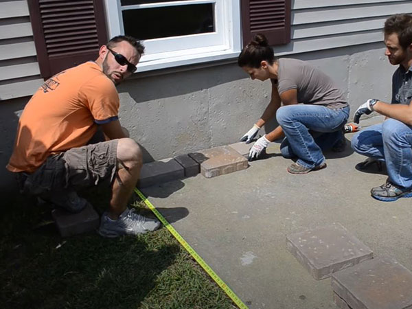 how to install pavers on a concrete pad